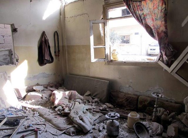 Daños provocados en una vivienda del barrio de Baba Amr, en Homs, Siria, durante un bombardeo de las fuerzas leales al presidente Bashar Assad.