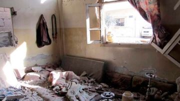 Daños provocados en una vivienda del barrio de Baba Amr, en Homs, Siria, durante un bombardeo de las fuerzas leales al presidente Bashar Assad.