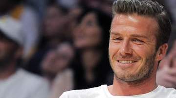 David Beckham con su hijo Brooklyn. El futbolista es un padre con glamour, según un estudio europeo.