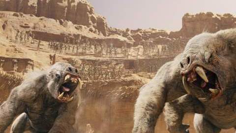 John Carter (Taylor Kitsch) huye de monstruos peligrosos en Marte en el filme 'John Carter'.