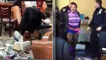 Imagen del video en que se ve a la mujer siendo arrestada luego de destrozar por completo el salón de belleza.