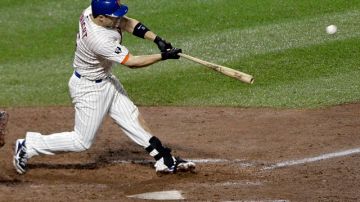 David Wright, de los Mets, conecta un doble remolcador en la séptima entrada del partido de anoche contra los Yankees en el Citi Field. Los Mets ganaron 6-4.