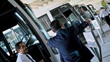 Bus drivers wait for passengers in Tijuana's bus station.