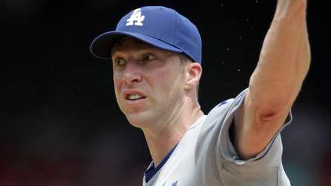 Chris Capuano fue maltratado por la batería de los Cardenales.