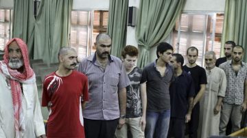 Siria ha concedido una amnistía general para los acusados de delitos cometidos en últimos disturbios; aquí, algunos de los liberados.