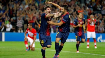 Messi y Villa celebran el tanto del triunfo del Barcelona frente al Spartak en la primera jorndada de la Champions.