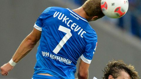 Hoffenheim's Boris Vukcevic, left, and Hannovers Adrian Nikci go for a header during the German first division Bundesliga soccer match between TSG 1899 Hoffenheim and Hannover 96 in Sinsheim, Germany, Sunday, Sept. 23, 2012. (AP Photo/dapd, Ronald Wittek)