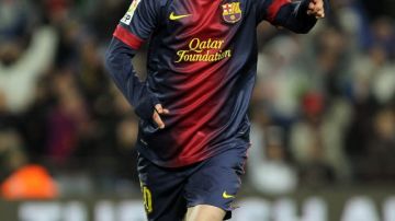 Messi celebra tras marcarle al Sevilla.