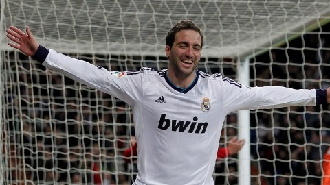 Real Madrid's Gonzalo Higuain from Argentina celebrates his goal during a Spanish La Liga soccer match against Mallorca at the Santiago Bernabeu stadium in Madrid, Spain, Saturday, March 16, 2013. (AP Photo/Andres Kudacki)