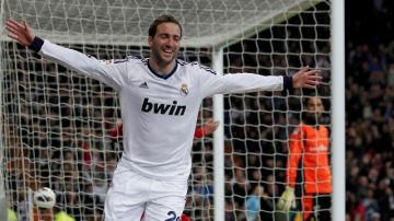 Real Madrid's Gonzalo Higuain from Argentina celebrates his goal during a Spanish La Liga soccer match against Mallorca at the Santiago Bernabeu stadium in Madrid, Spain, Saturday, March 16, 2013. (AP Photo/Andres Kudacki)