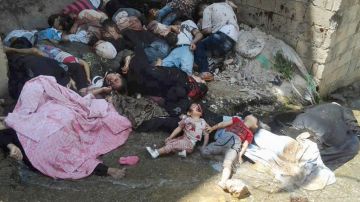 La Cruz Roja quiere levantar los cuerpos de las víctimas en el terreno de guerra en Siria.