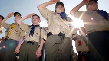 Boy Scouts salute early Saturday morning, May 21, 2011 during New Jersey's Boy Scouts Camporee in Sea Girt, N.J. The Boy Scouts of America's National Council has voted to ease a long-standing ban and allow openly gay boys to be accepted as Scouts, Thursday, May 23, 2013. Of the local Scout leaders voting at their annual meeting in Texas, more than 60 percent supported the proposal. (AP Photo/Mel Evans, file)