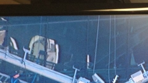 Imagen tomada de la tele y que muestra a los obreros atrapados en Manhattan.