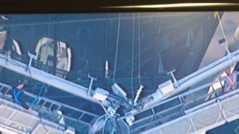 Imagen tomada de la tele y que muestra a los obreros atrapados en Manhattan.