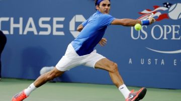 Roger Federer, of Switzerland, chases down a shot to return to Tommy Robredo, of Spain, during the fourth round of the 2013 U.S. Open tennis tournament, Monday, Sept. 2, 2013, in New York. (AP Photo/Darron Cummings)