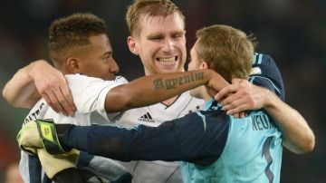De izq. a der. Jerome Boateng, Per Mertesacker y Manuel Neuer celebran la clasificación de Alemania a otra cita mundialista.