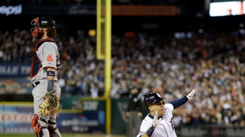 Detroit Tigers' Jose Iglesias scores on a double by Torii Hunter in the second inning during Game 4 of the American League baseball championship series against the Boston Red Sox, Wednesday, Oct. 16, 2013, in Detroit.  (AP Photo/Matt Slocum)