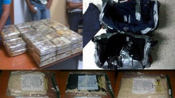 Cargamento de cocaína encontrado por las autoridades en el interior de dos bultos de color azul y negro.