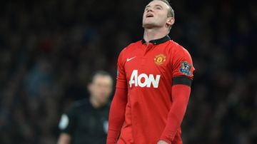 Wayne Rooney lamenta el empate de su equipo ante Fulham.