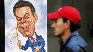 Colombia realizará la segunda ronda de sus elecciones, este domimgo, entre el presidente Juan Manuel Santos (en la caricatura) y su opositor Óscar Iván Zuluaga.