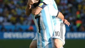 SAO PAULO, BRAZIL - JULY 01:  Angel Di Maria of Argentina celebrates scoring with Lionel Messi of Argentina during the 2014 FIFA World Cup Brazil Round of 16 match between Argentina and Switzerland at The Arena de Sao Paulo on July 01, 2014 in Sao Paulo, Brazil. (Photo by Ian MacNicol/Getty Images)