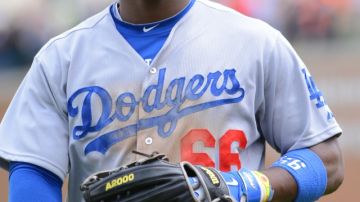 Yasiel Puig #66 of the Los Angeles Dodgers looks on during the game.