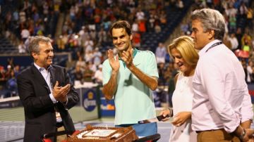 TORONTO, ON - AUGUST 08:  Roger Federer of Switzerland with his birthday cake after a quarterfinals win against David Ferrer of Spain during Rogers Cup at Rexall Centre at York University on August 8, 2014 in Toronto, Canada.  (Photo by Ronald Martinez/Getty Images)