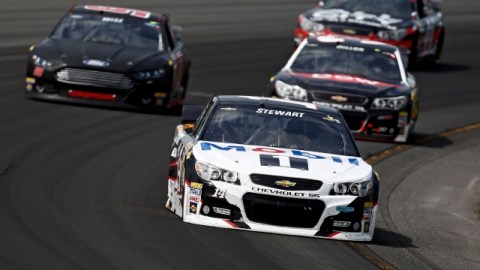 Tony Stewart, driver of the #14 Mobil 1/Bass Pro Shops Chevrolet, leads a pack of cars during the NASCAR Sprint Cup Series Pocono 400 at Pocono Raceway on June 8, 2014 in Long Pond, Pennsylvania. (Photo by Jeff Zelevansky/Getty Images)