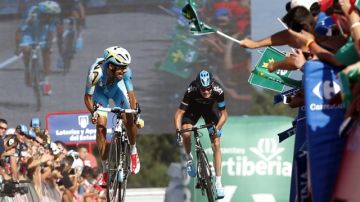 El italiano Fabio Aru (i) supera en la meta a Christopher Froome (d) para ganar la  décimoctava de la Vuelta.