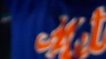 Jugadores de los Mets festejan una carrera de Lagares conseguida en el quinto inning.