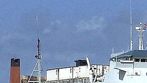 A Havana resident watches as the Express