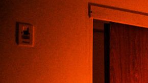 A chambermaid makes a bed at a hotel to