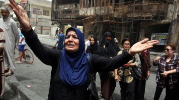 An Iraqi woman reacts on July 4, 2016 at the site of a suicide-bombing attack which took place a day earlier in Baghdad's Karrada neighbourhood . Iraqis mourned the more than 200 people killed by a jihadist-claimed suicide car bombing that was among the deadliest ever attacks in the country. The blast, which the Islamic State group said it carried out, hit the Karrada district early on July 3 as the area was packed with shoppers ahead of this week's holiday marking the end of the Muslim fasting month of Ramadan. / AFP / AHMAD AL-RUBAYE (Photo credit should read AHMAD AL-RUBAYE/AFP/Getty Images)