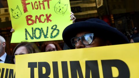 Woman gather in front of Trump Tower October 17, 2016 in New York to protest against Donald Trump's "treatment of women" during a rally against the 2016 Republican presidential nominee Donald Trump. Donald Trump has stepped up claims the presidential election will be rigged against him, as polls showed support slipping away from the Republican candidate only three weeks from the vote.The bombastic billionaire fired off a series of erratic Twitter broadsides at his opponent Hillary Clinton and the media over the weekend as tensions mount ahead of the November 8 election. / AFP / TIMOTHY A. CLARY (Photo credit should read TIMOTHY A. CLARY/AFP/Getty Images)