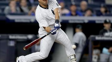 NEW YORK, NY - MAY 13:  Gary Sanchez #57 grounds out in the ninth inning against the Chicago White Sox at Yankee Stadium on May 13, 2016 in the Bronx borough of New York City.The Chicago White Sox defeated the New York Yankees 7-1.  (Photo by Elsa/Getty Images)
