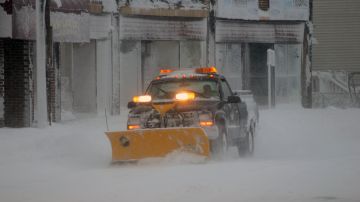 WINTHROP, MA - FEBRUARY 9: A snow plow drives along Shirley Street on February 9, 2013 in Winthrop, Massachusetts. The powerful storm has knocked out power to 650,000 and dumped more than two feet of snow in parts of New England. (Photo by Darren McCollester/Getty Images)