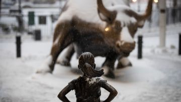NEW YORK, NY - MARCH 14: The 'Fearless Girl' statue stands in the snow and wintry mix in the Financial District, March 14, 2017 in New York City. The blizzard warning for New York City has been cancelled and the National Weather Service is now predicting 4 to 8 inches for the city. (Photo by Drew Angerer/Getty Images)
