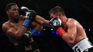 NEW YORK, NY - MARCH 18:  Gennady Golovkin punches Daniel Jacobs  during their Championship fight for Golovkin's WBA/WBC/IBF middleweight title at Madison Square Garden on March 18, 2017 in New York City.  (Photo by Al Bello/Getty Images)