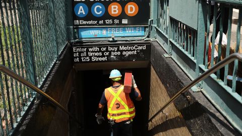 NEW YORK, NY - JUNE 27:  A Metropolitan Transportation Authority (MTA) worker enters a Harlem subway station where a morning train derailment occurred on June 27, 2017 in New York City. Thirty-four people suffered minor injuries in the subway derailment which causes major delays throughout the morning and afternoon. This is the latest incident for the MTA, the largest subway system in the country, and has city officials scrambling to make repairs and updates to the aging system.  (Photo by Spencer Platt/Getty Images)