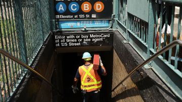 NEW YORK, NY - JUNE 27:  A Metropolitan Transportation Authority (MTA) worker enters a Harlem subway station where a morning train derailment occurred on June 27, 2017 in New York City. Thirty-four people suffered minor injuries in the subway derailment which causes major delays throughout the morning and afternoon. This is the latest incident for the MTA, the largest subway system in the country, and has city officials scrambling to make repairs and updates to the aging system.  (Photo by Spencer Platt/Getty Images)
