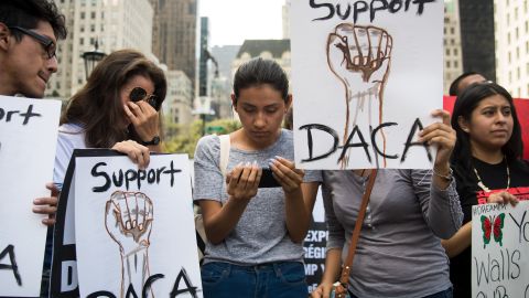 NEW YORK, NY - SEPTEMBER 5: (L to R) Marlon Ruales, Dayana Arrue, Sofia Ruales, and Erica Ruales, all in their early 20s and "dreamers"originally from Ecuador, watch Attorney General Jeff Sessions' remarks on ending the Deferred Action for Childhood Arrivals program on Sofia's smartphone before a protest in Grand Army Plaza in Manhattan, September 5, 2017. On Tuesday, the Trump administration announced they will end the Deferred Action for Childhood Arrivals program, with a six month delay. The decision represents a blow to young undocumented immigrants (also known as 'dreamers') who were shielded from deportation under DACA. (Photo by Drew Angerer/Getty Images)