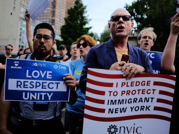 NEW YORK, NY - JUNE 29: Recent Immingrants join activists for an evening protest in Manhattan hours before a revised version of President Donald Trump's travel ban that was approved by the Supreme Court is to take effect on June 29, 2017 in New York City. Hundreds of protesters marched through the streets demanding and end to the ban which prohibits for 90 days the entry of travellers from six predominantly Muslim countries: Iran, Libya, Somalia, Sudan, Syria and Yemen. The court granted an exception for people with 'bona fide relationships' in the United States. (Photo by Spencer Platt/Getty Images)