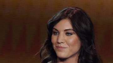 Hope Solo y Joseph Blatter, en el Balón de Oro de 2013