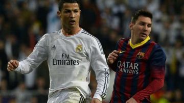 Cristiano Ronaldo y Lionel Messi durante un juego entre Barcelona y Real Madrid, hace tres años.