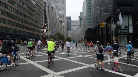 People ride, run or walk along a car-free Park Avenue during the Summer Streets event in New York, August 3, 2013. Summer Streets is an annual event that closes miles of New York roadway from uptown to downtown to car traffic, so pedestrians can walk, bike, run, do yoga or take part in activities such as ride a zip line, climb a climbing wall or participate in fitness or dance programs along the way. AFP PHOTO/Emmanuel Dunand (Photo credit should read EMMANUEL DUNAND/AFP/Getty Images)