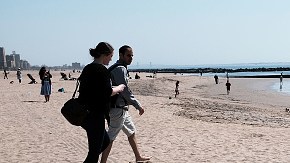 NEW YORK, NY - APRIL 14:  People relax along the beach at Coney Island on a spring afternoon on April 14, 2018 in New York City. Following weeks of cold, snow and ice, New Yorkers got a taste of spring today with mild temperatures and blue skies. Cold weather is expected to return on Sunday.  (Photo by Spencer Platt/Getty Images)