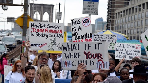 Almost 100 people march across the Brooklyn Bridge to tell Albany legislators to pass the Child Victims Act that would eliminate the statute of limitations on how long survivors can seek justice on Sunday, June 4, 2017.  (Photo by Jefferson Siegel/NY Daily News via Getty Images)