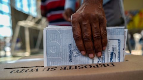 A man casts his vote at a polling station in Cali, Valle del Cauca Department, during parliamentary elections in Colombia on March 11, 2018.
Colombians went to the polls Sunday to elect a new Congress with a resurgent right, bitterly opposed to a peace deal that allows leftist former rebels to participate, expected to poll strongly. The election is set to be the calmest in half a century of conflict in Colombia, with the former rebel movement FARC spurning jungle warfare for politics, and the ELN -- the country's last active rebel group -- observing a ceasefire.
/ AFP PHOTO / Luis ROBAYO (Photo credit should read LUIS ROBAYO/AFP/Getty Images)