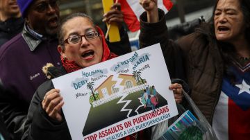 NEW YORK, NY - DECEMBER 20: Protestors rally against foreclosures on Puerto Rican families affected by Hurricane Maria, outside the offices of TPG Capital, December 20, 2017 in New York City. The activists claims that TPG Capital's mortgage service companies are aggressively foreclosing on families in Puerto Rico after many people were displaced from their homes following Hurricane Maria. (Photo by Drew Angerer/Getty Images)