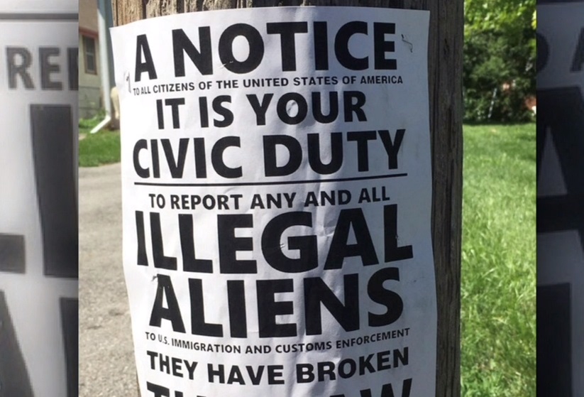 "Es tu deber reportar a extranjeros indocumentados", dice parte del cartel.